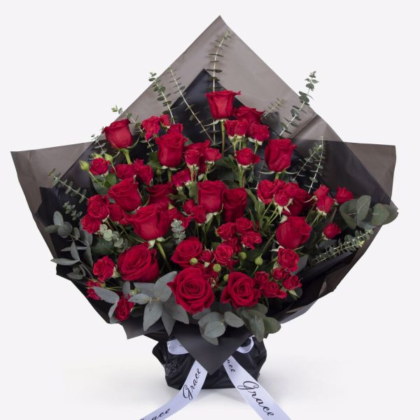 Red Roses in black wrapper